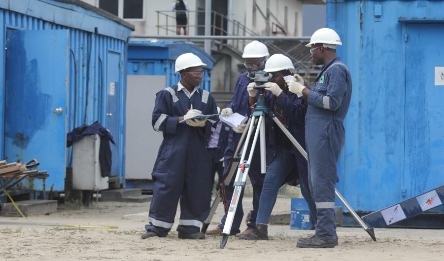 Trainees recording level readings during a site survey exercise