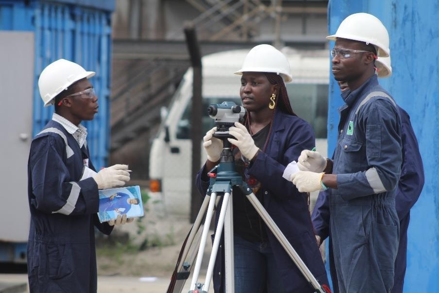 Surveying practical with a levelling instrument on site
