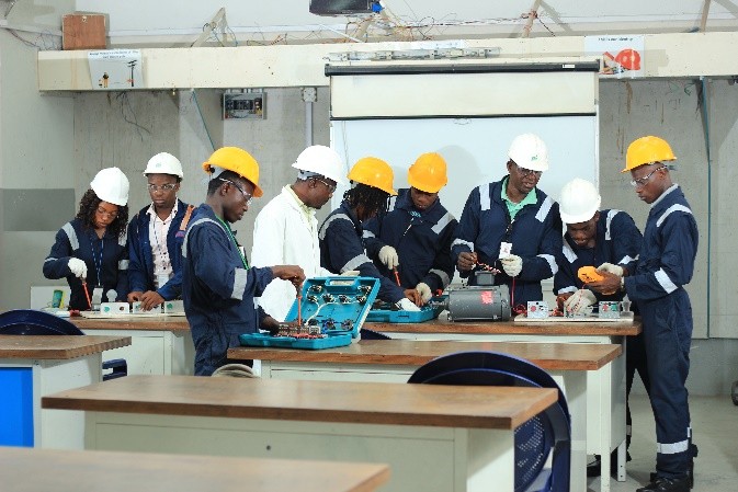 Electrical installation class working through bench exercises